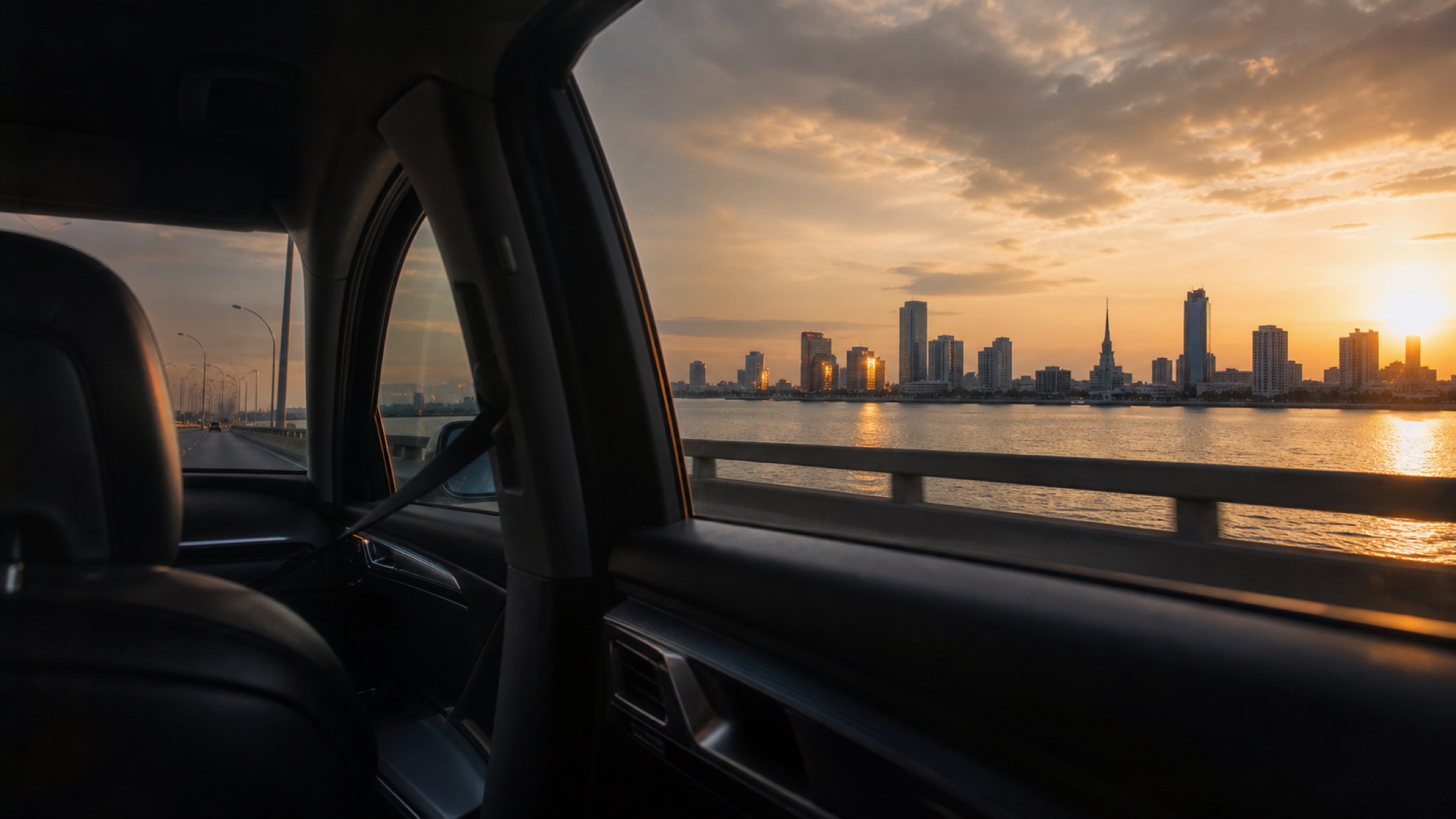 Lagos lagoon and skyline at golden hour, seen from a private transfer